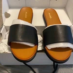 Brand new Aldo black slip on sandals. Size 7.5M